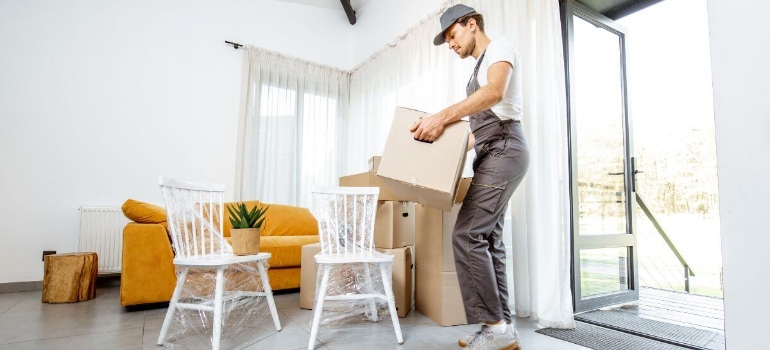 a mover carrying a box 