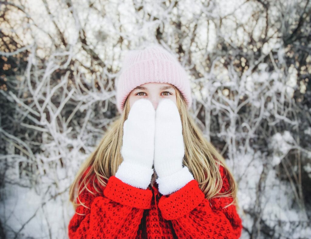 woman standing outside with white gloves