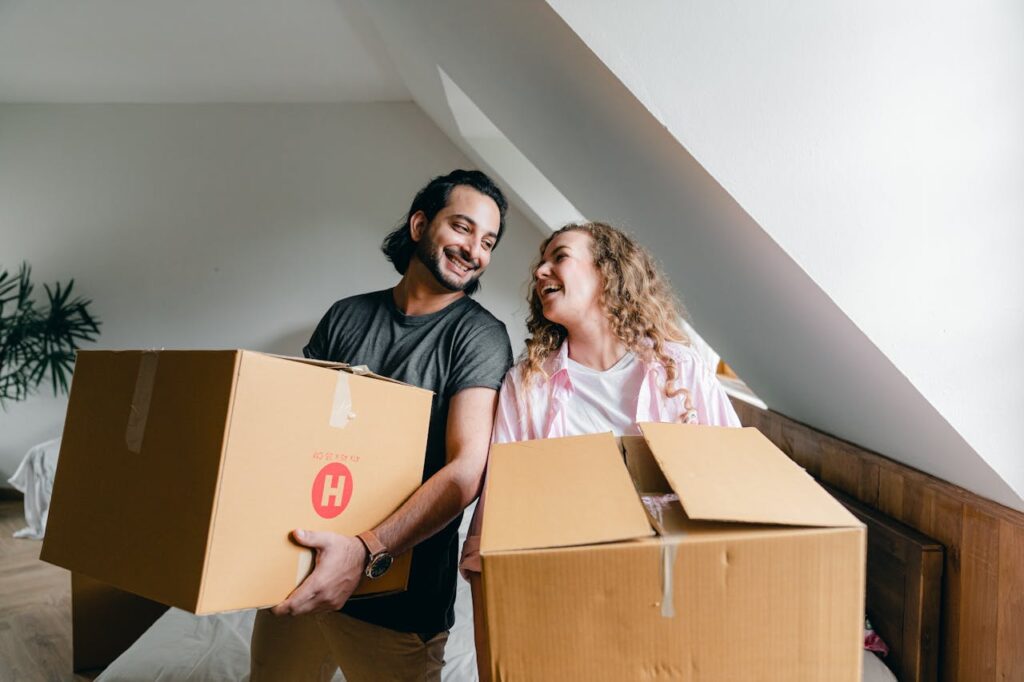 a couple holding boxes