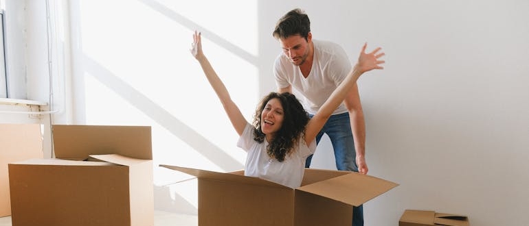 a happy couple ready to move with movers in Wildwood MO