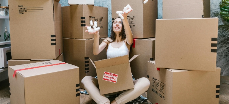 a woman throwing packing peanuts in the air 