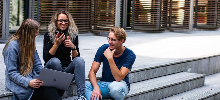 students talking after a class, Moving to Fenton