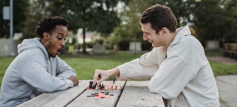 people playing chess in the park